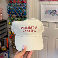 Property of personalised slogan unisex cap