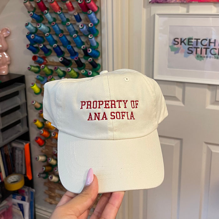 Property of personalised slogan unisex cap