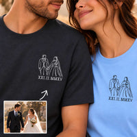 Two people wearing matching graphic T-shirts with a white line drawing of a bride and groom and the Roman numerals 'XXI. II.